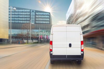 Delivery van driving through city