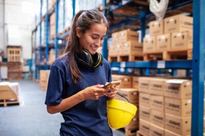 Warehouse worker on her phone