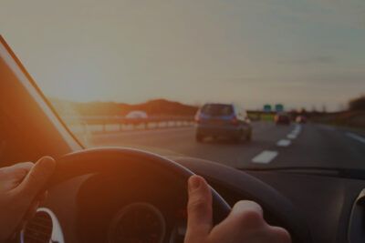 Driver’s perspective on highway travel during sunset