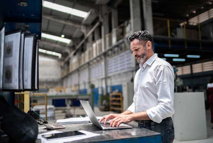 An owner of a mid-sized business reviews his fleet’s fuel card usage in real-time from his laptop.