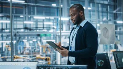 A business owner reviews fleet fuel card data reporting from his tablet in real-time.
